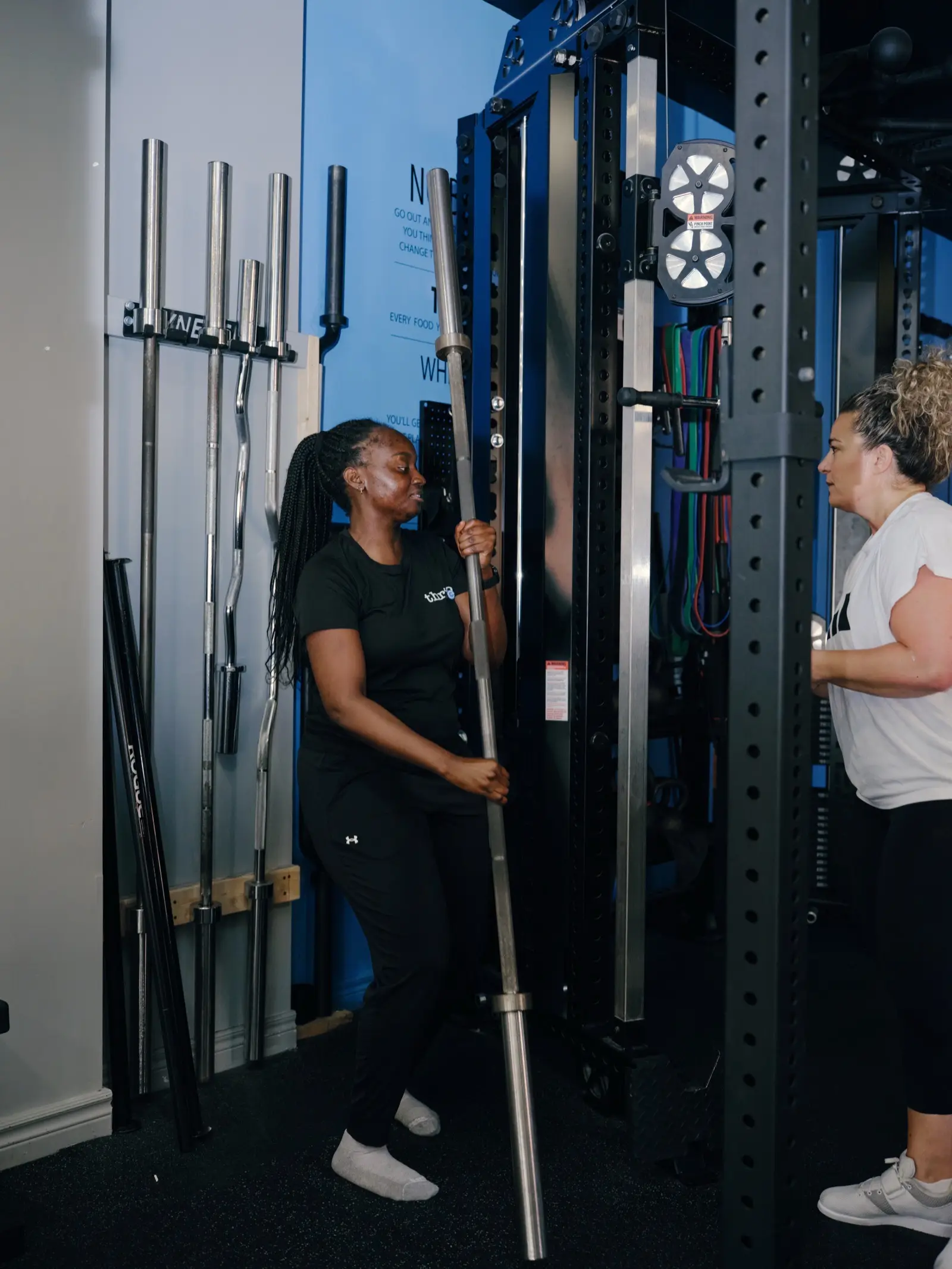 A Thrive Fit coach working with a member during a semi-private session in The Beaches